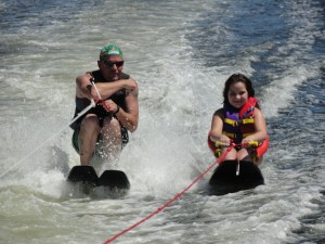Reaghan Velasquez (right) of Manvel enjoys waterskiing for the first time Sept. 11 alongside volunteer Tim Thelen of Houston at the 20th annual Moody Gardens Adaptive Sports Festival. Reaghan, 8, is paralyzed from the calves down. 